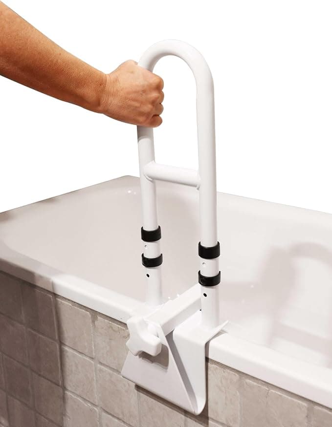 Barre d'appui fixée par serrage sur le rebord d'une baignoire