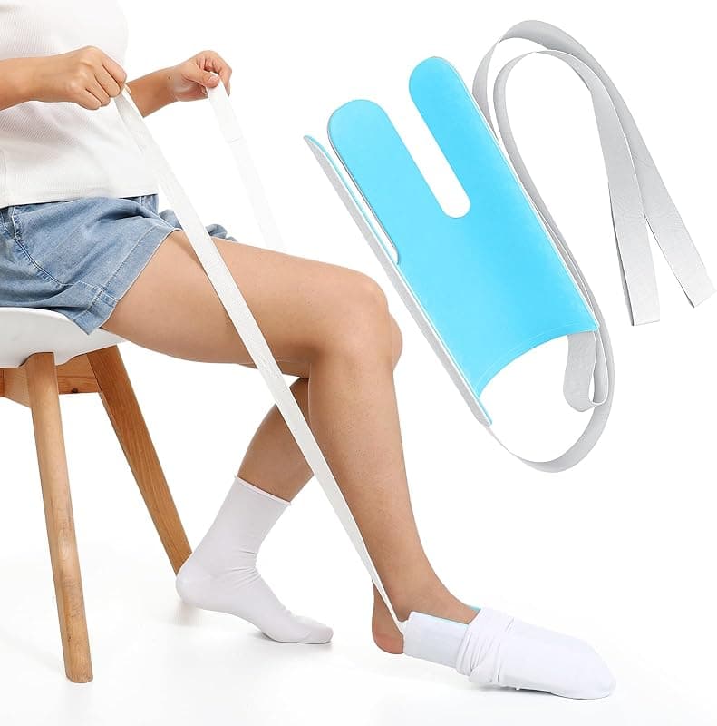 Enfile-bas de contention avec sangles utilisé pour enfiler une chaussette