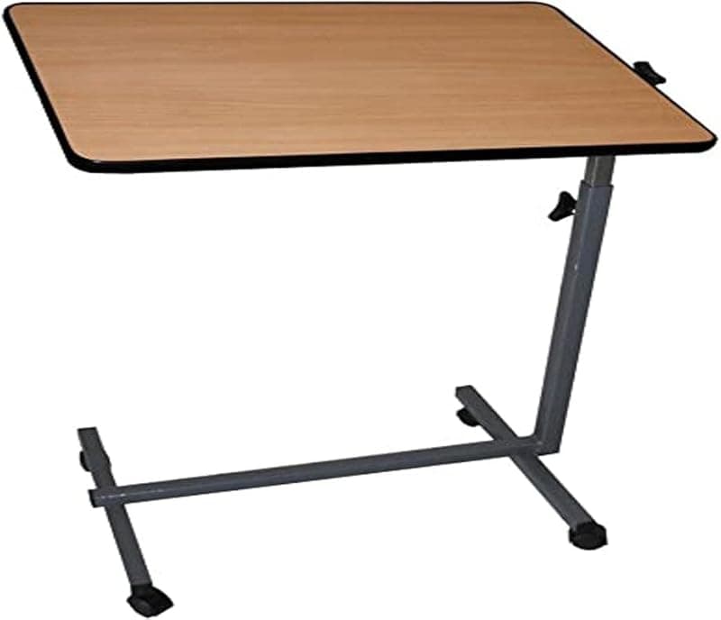 Table de lit à roulettes avec plateau inclinable au-dessus d'un lit